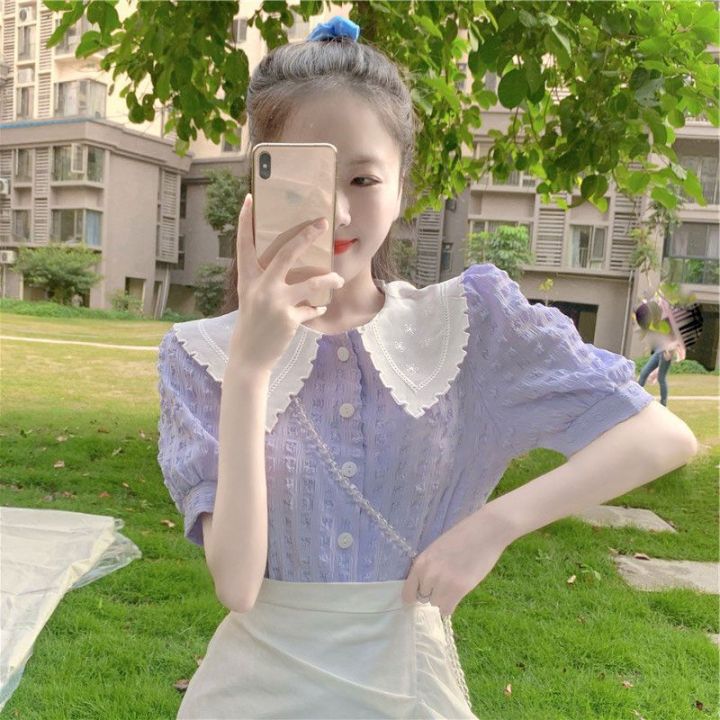 เสื้อสตรีฤดูร้อนเกาหลีกลวงย้อนยุคเสื้อแขนพัฟสีม่วงตุ๊กตาปกเก๋ไก๋