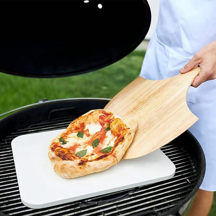 wooden-pizza-board-round-with-hand-pizza-baking-tray-pizza-stone-cutting-board-platter-pizza-cake-paragraph