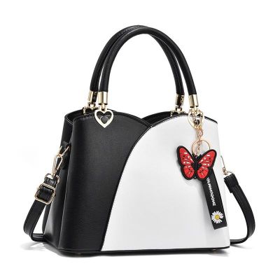 Female bag 2021 new fashionable color matching handbag high-capacity butterfly pendant middle-aged female bag shoulder inclined shoulder bag
