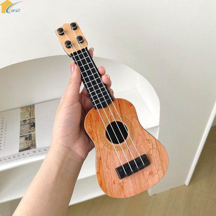 Đồ Chơi Đàn Ukulele Mini Để Bàn Trang Trí 〖QYUE〗 | Lazada.vn