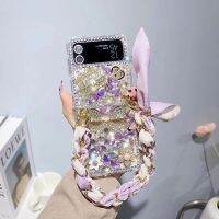 เคสฝาหลังติดโบว์สำหรับ Galaxy Z Flip 3 4 5 3D หรูหราประดับพลอยเทียมระยิบระยับสำหรับ Samsung Galaxy Z Flip 3 4 5 5G เคสพร้อมโซ่มือถุงมือสีทองโลหะ