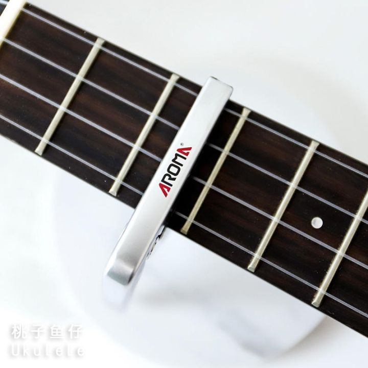original-high-efficiency-peach-fish-baby-ukulele-ukulele-ukulele-small-guitar-arnoma-capo-ac-03