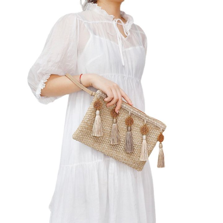 กระเป๋ากระเป๋าคลัตช์ถักประดับพู่ระดับพรีเมี่ยมของผู้หญิงแบบใหม่กระเป๋าแบบซองจากฟางประดับแบบแผง