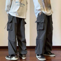 Mens Cargo กางเกง Casual Multi-Pocket Streetwear สีดำ Harajuku Hip Hop กางเกง Elastic เอว Harem ข้อเท้าความยาวกางเกง