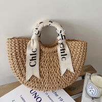 Uniqlo New Fashion version Alphabet silk scarf portable straw bag versatile semi-circle straw bag versatile womens bag seaside resort style beach bag