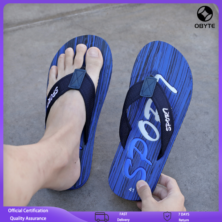 Man Feet Wearing Shorts And Flip Flops Standing Outdoor Summer Vacations  Lifestyle Concept Stock Photo, Picture and Royalty Free Image. Image  26296220.