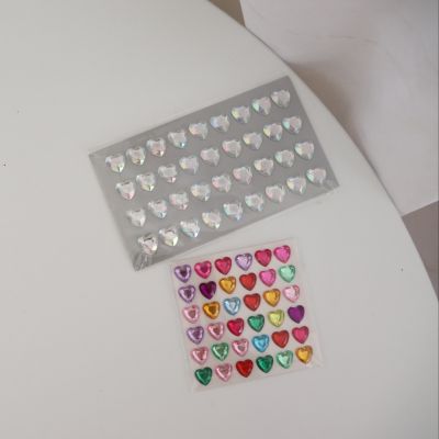 Various forms of waterproof 3D heart shaped stickers for decoration.
