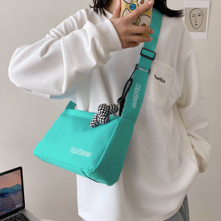 koreafashionshop-kr1851-กระเป๋าสะพายข้างkonbag-ผ้าอ๊อกซ์ฟอร์ด-แถมที่ห้อย