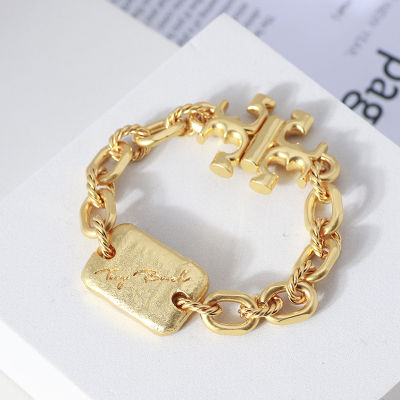 Tory Burch Punk Wind Bracelet ชุบทอง Matte โซ่หนาทองข้ามโลโก้แม่เหล็กดูดสร้อยข้อมือเครื่องประดับผู้หญิง