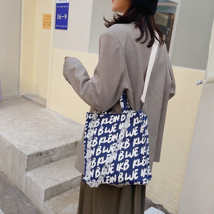 cross-border-new-klein-blue-one-shoulder-his-canvas-bag-female-western-style-letters-printing-large-capacity-hand-held-tote-bags