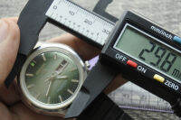 นาฬิกา Vintage มือสองญี่ปุ่น RICOH RIQUARTZ DX ระบบ QUARTZ ผู้ชาย ทรงกลม กรอบเงิน หน้าปัดสีเขียว หน้าปัด 36มม. ตัวเรือนสแตนเลสใช้งานได้ปกติ สภาพดี ของแท้ ไม่กันน้ำ