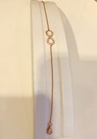 สร้อยข้อมือสัญลักษณ์อินฟินิตี้ตัวเรือนเงินแท้ชุบทองคำRose Gold Sterling Silver Rose Toned Infinity Symbol Bracelet with Cubic Zirconias