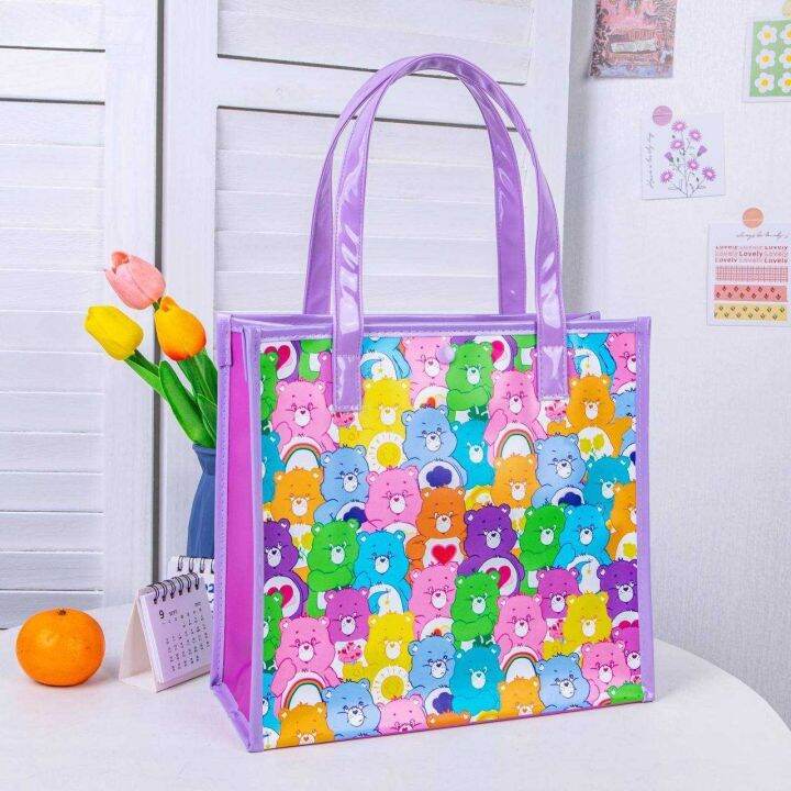 carebear-กระเป๋าใบเล็ก-มีทั้งหมด-4-สี-ลาย-full-print-งาน-pvc-พลาสติกหนา-กันน้ำ-มีกระดุมติดปากกระเป๋า-ขนาด-27-27-10-cm