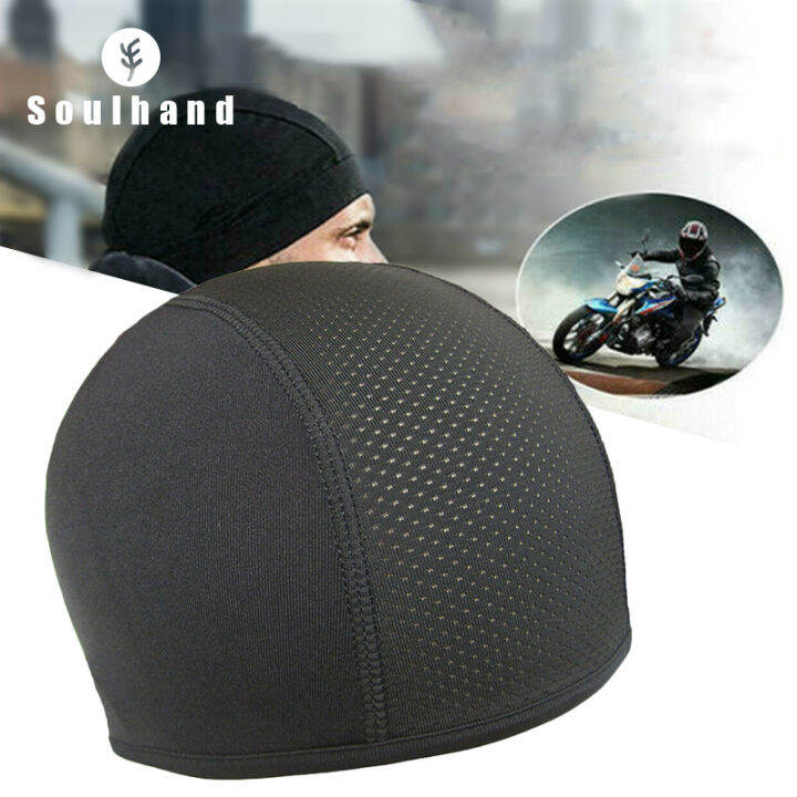 wearing a hat under a bike helmet