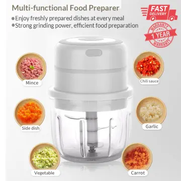 Grinding Carrots Using An Electric Food Processor Stock Photo