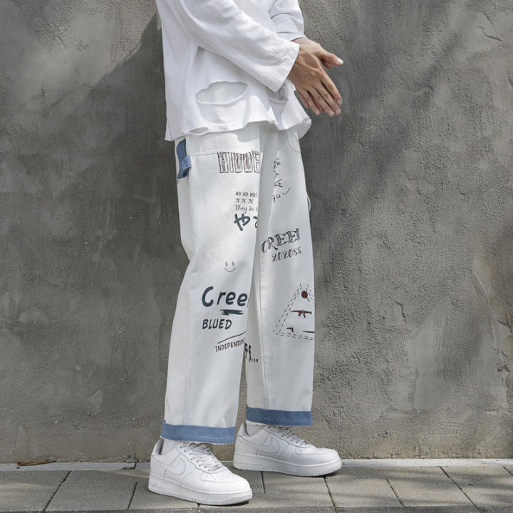 พิมพ์ฮิปฮอปตรงกางเกงยีนส์ผู้ชายถุงสบายๆขากว้างเกาหลีฮาราจูกุแฟชั่นสตรีกระเป๋ากางเกงยีนส์ชาย