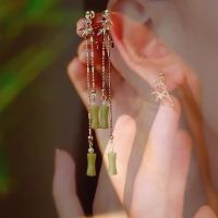 Olive, jade, bamboo knot tassel earrings, womens new Chinese ancient style cheongsam earrings, national style niche high-end earrings, and thread JH46