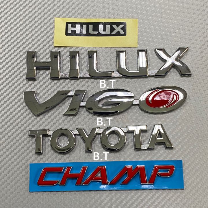 โลโก้* Hilux + vigo + Toyota + champ + สติ๊กเกอร์ คำว่า Hilux งานฟอย  ( 1 ชุดมี 5 ชิ้น )