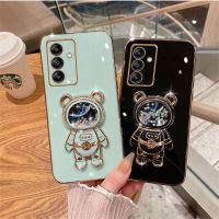 เคสโทรศัพท์2023 Samsung Galaxy A24 M14 A14 A34 5G 4G นิ่มแฟชั่นชุบแวววาวพร้อมตัวยึดหมีอวกาศและทรายดูดเคสฝาครอบป้องกันเลนส์กล้องสำหรับ A34 SamsungA14 GalaxyA54 5G