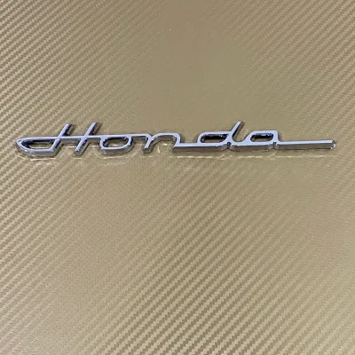 AD. โลโก้* HONDA ตัวหนังสือตัวเขียน ขนาด*2.5x21.7cm สีเงินชุบโครเมี่ยม