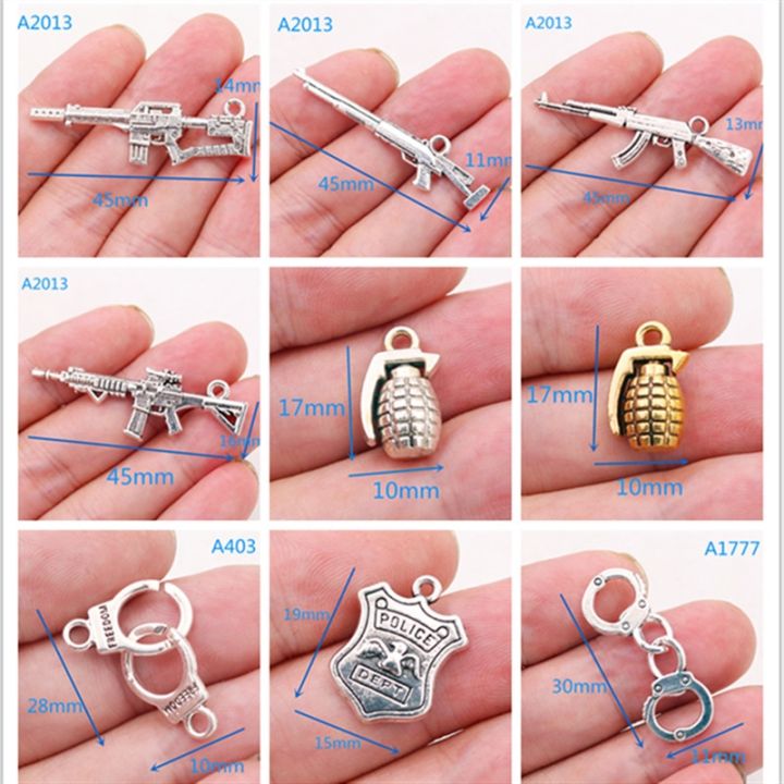 cw-weapons-metal-pendants-handcuffs-charms-badges-firearms-grenades-charms