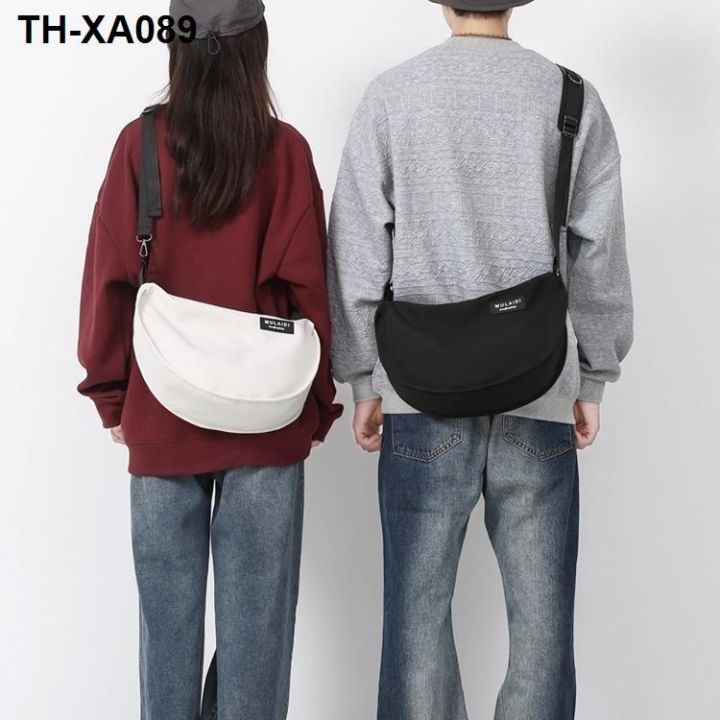 niche-ออกแบบกระเป๋าทรงเกี๊ยวหญิง-2023-ใหม่เวอร์ชั่นเกาหลีนักเรียนเบาสบาย-ๆ-กระเป๋าสะพายข้าง-messenger-กระเป๋าพร็อพ
