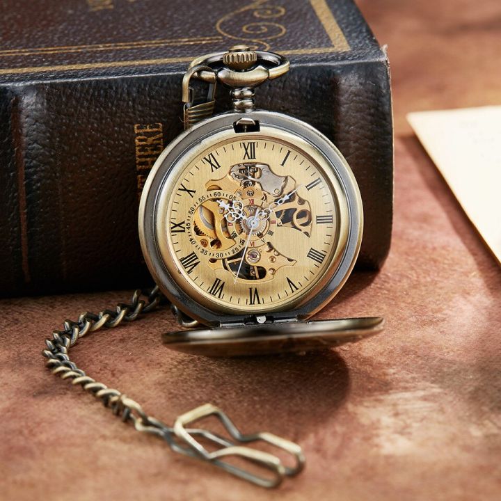 นาฬิกาพกกลไกรถจักรแบบย้อนยุคดีไซน์ด่วนแบบขั้วโลกโครงกระดูกกลวงสีบรอนซ์ของผู้ชายโซ่นาฬิกาพกกล