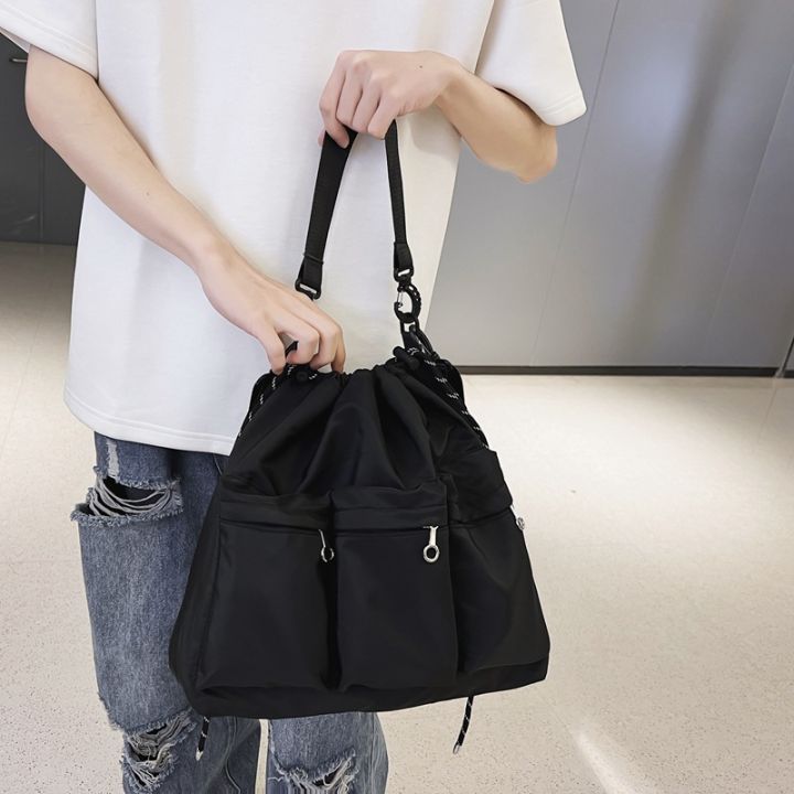 ins-trendy-brand-crossbody-bag-mens-niche-design-drawstring-shoulder-bag-womens-sports-riding-black-tooling-bag-2023