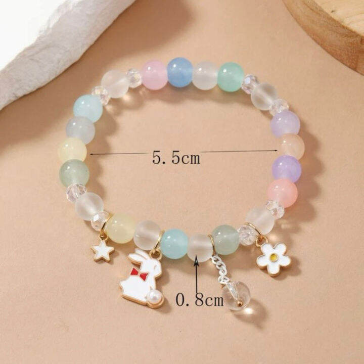 พร้อมส่ง-สร้อยข้อมือลูกปัดกระต่าย-ดอกไม้-และดวงดาว-เอ็นยืดได้