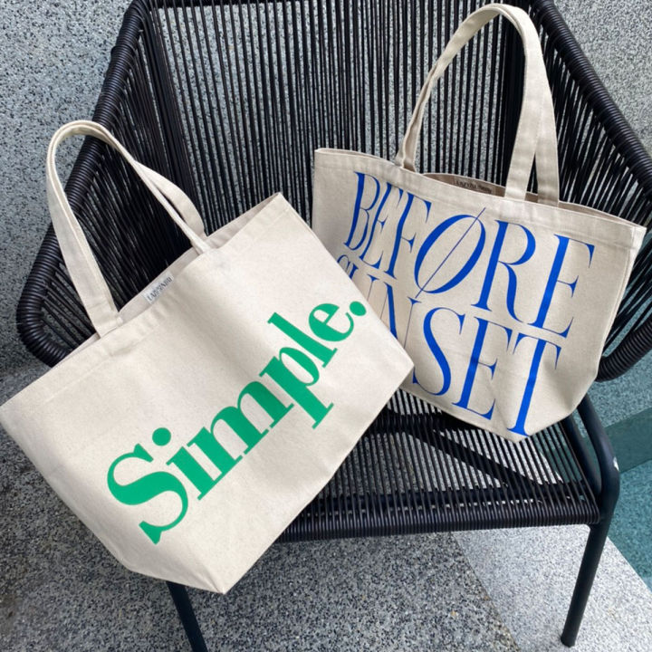 justbehappy-tote-bag-กระเป๋าผ้าลดโลกร้อน-สกรีนลาย-simple-amp-goodluck