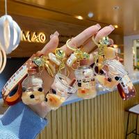 Pearl milk tea floating quicksand bottle key chain creative little milk bear into the oil pendant couple gift bag pendant female key toys