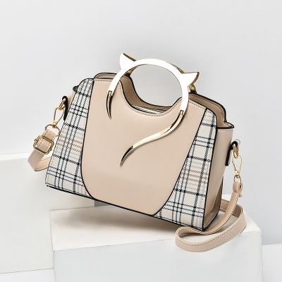 Wholesale handbags female 2021 new fashion female package bump color laptop bag temperament of Europe and the United States shoulder inclined shoulder bag