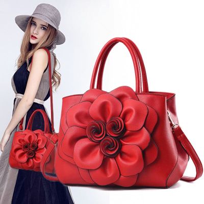 กระเป๋าแฟชั่นผู้หญิง ตกแต่งดอกไม้ หนัง PU สีสันสดใส มี 6 สี  ดำ แดง ม่วง เทา กากี โอรส แถมฟรี พวงกุญแจรูปกระเป๋า
