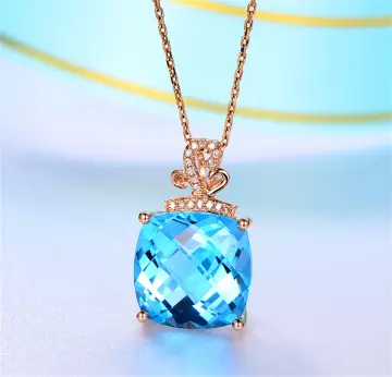 Gold necklace with blue on sale pendant