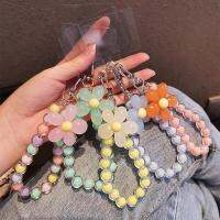 สร้อยข้อมือลูกปัดดอกไม้สดใสขนาดเล็กสายคล้องข้อมือ Diy สากลกระเป๋าใส่หูฟังสีลูกอมเคสโทรศัพท์มือถืออุปกรณ์โซ่มือ