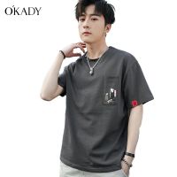 OKADY ฤดูร้อนใหม่เสื้อยืดแขนสั้นผู้ชายลายการ์ตูนกระเป๋าหน้าอกครึ่งแขนเวอร์ชั่นเกาหลีหลวมนักเรียนแขนสั้น