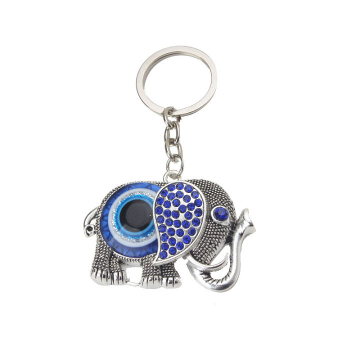 จี้กุญแจจี้รูปสัตว์พวงกุญแจดวงตาปีศาจพวงกุญแจช้างงานฝีมือของผู้ชายซงเฉิง