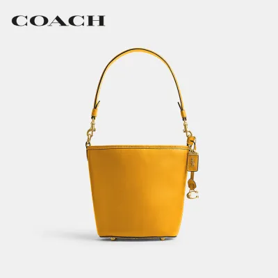COACH กระเป๋าสะพายข้างผู้หญิงรุ่น Dakota Bucket Bag 16 With Braid สีเหลือง CJ815 B4/UA