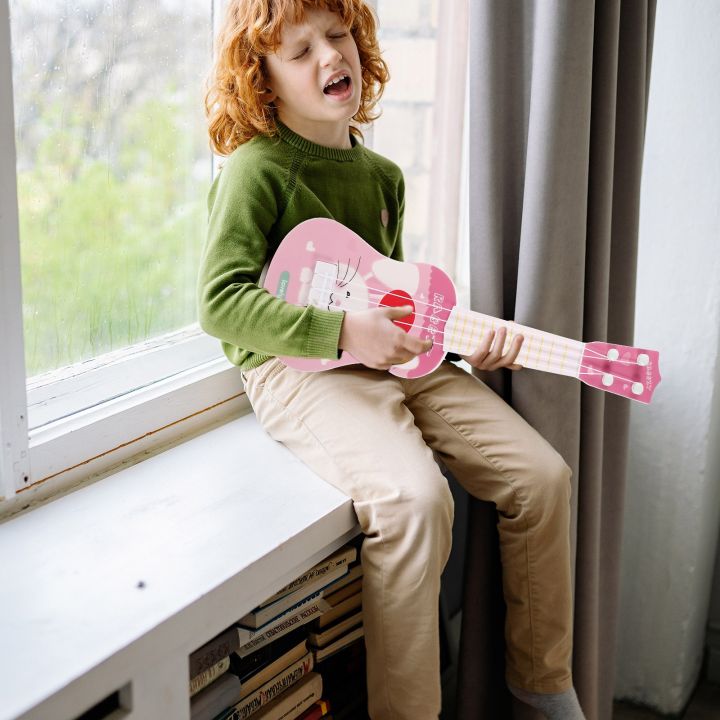 อูคูเลเล่ของเล่นเครื่องดนตรีกีตาร์เด็กสำหรับเด็กมือใหม่หัดเล่นกีตาร์รุ่นแรกเล่นอูคูเลเล่ปี