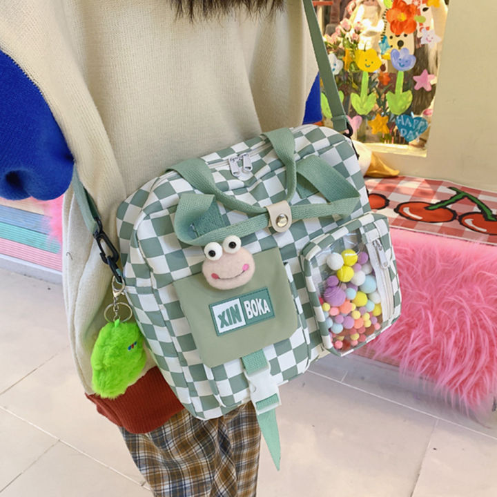 กระเป๋านักเรียนกระเป๋าสะพายลายตารางญี่ปุ่นท่องเที่ยวของเด็กผู้หญิงนักเรียนกระเป๋าหิ้วมีจี้