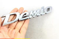 โลโก้เดมิโอ มาสด้า สีเงิน ติดด้านหลัง Demio Letter Logo Car Auto Rear Trunk Emblem Sticker Badge Decal Replacement For MAZDA Demio