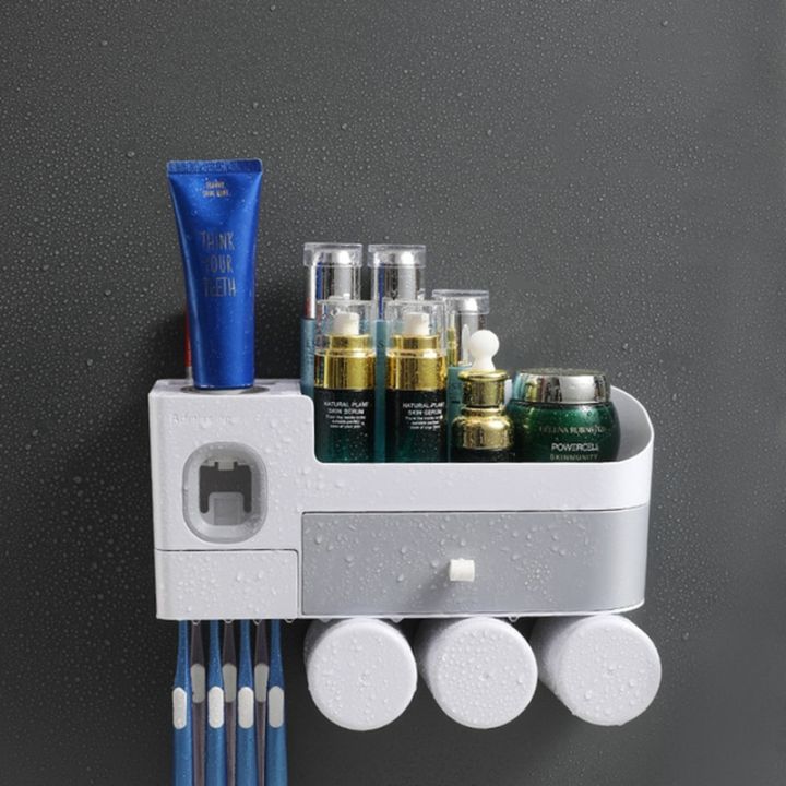 ชั้นวางที่บีบยาสีฟันแบบอัตโนมัติแปรงสีฟันติดผนังพร้อมชุดอุปกรณ์ห้องน้ำลิ้นชัก