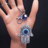 [HOT HUIQKKJKUIO 556] Hamsa มือตุรกี Blue Eye Alloy พวงกุญแจผู้หญิง Evil Eyes สีเงิน Lucky Protection Key แหวนจี้เครื่องประดับมุสลิม KXH527