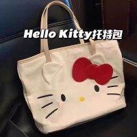 Hello Kitty กระเป๋าผ้าใบผู้หญิง2022แฟชั่นบรรจุของได้มากใหม่กระเป๋าการ์ตูนกระเป๋าช้อปปิ้งสะพายไหล่กระเป๋าทรงสี่เหลี่ยมมีหูหิ้วสะพายไหล่สไตล์มหาลัย