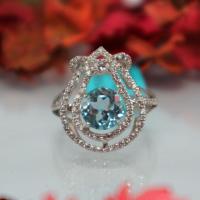 Jewelrythai แหวนพลอย Sky Blue Topaz เงินแท้ 925 ล้อมเพชร CZ เครื่องประดับ แหวนผู้หญิง งดงาม หรูหรา พลอยแท้ สีฟ้า โทพาส ดีไซน์หรูหรา พลอยดิบ ไซส์ 56