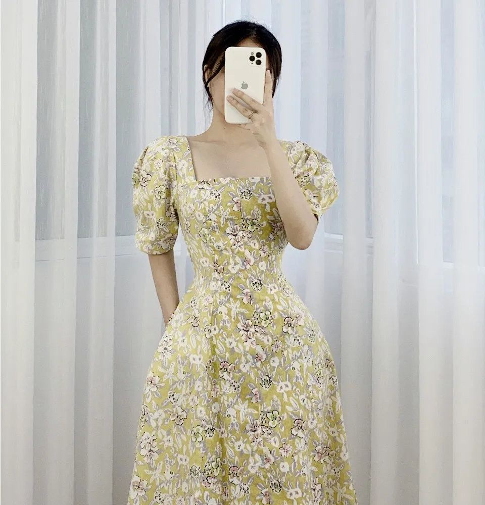 Váy bé gái vải thô hoa nhí màu xanh cỡ 30kg 50kg